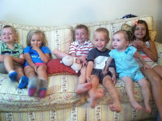 A photo of the cousins on the couch